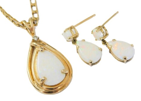 A 9ct gold opal and diamond pendant, on a curb link neck chain, together with a pair of matching drop earrings, 5.3g.