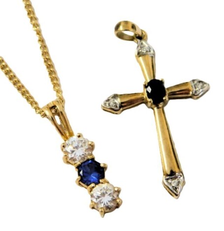 A 9ct gold sapphire and diamond cross pendant, together with a 9ct gold and gem set pendant on a curb link neck chain, with bolt ring clasp, 4.9g.