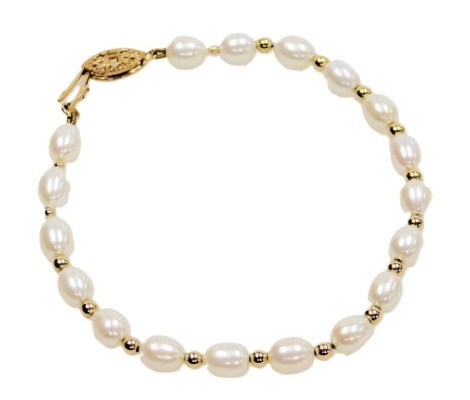 A freshwater pearl bracelet, on a plated fish hook clasp, and with yellow metal balls at intervals.