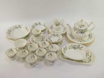 A Royal Albert porcelain part tea and dinner service decorated in the Brigadoon pattern, comprising a teapot and stand, milk jug, sugar bowl, eight teacups, eight saucers, six cake plates, rectangular sandwich plate, two bowls, one coffee cup, five breakf - 2