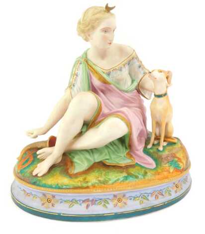 A 19thC French bisque porcelain figure group, modelled as a seated lady in classical dress beside a Whippet, on an oval base, impressed marks L and M, 29cm high.