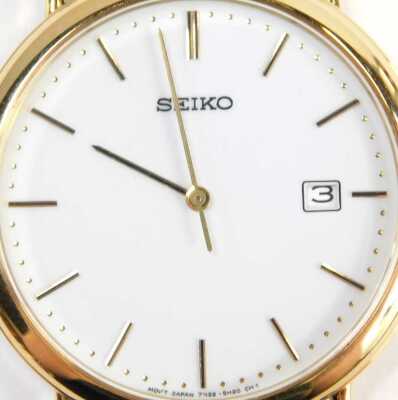 A Seiko gent's wristwatch, with white enamel dial, in a 9ct gold case, engraved MJF Service 1976-1997 Spirax-Sarco Limited, serial number 380803, 9ct gold with import marks, on a black leather strap, the dial 3cm wide. - 2