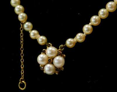 A two strand cultured pearl necklace, the clasp cluster set with a ruby and pearls, 40cm long. - 2