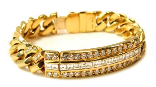 An 18ct gold diamond identity bracelet, the panel with round brilliant cut diamonds, 88.6g all in, approx 20cm long.