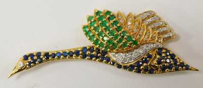 An 18ct gold bird brooch, set with sapphires, emeralds and diamonds, 6.5cm diameter, 11.9g. The weight is 11.9g. - 2