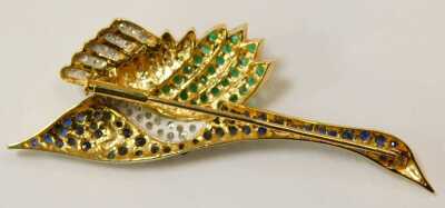 An 18ct gold bird brooch, set with sapphires, emeralds and diamonds, 6.5cm diameter, 11.9g. The weight is 11.9g. - 3