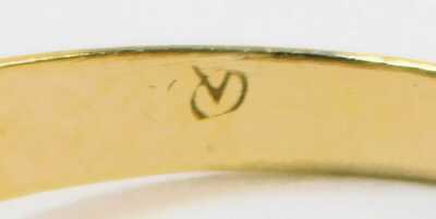 A love heart ring, formed as two hearts, each set with tiny diamonds, with three ribbed shoulders, yellow metal, unmarked, ring size O½, 2.5g all in. - 2