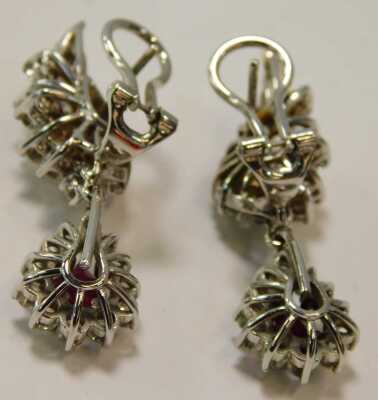 A pair of ruby, diamond and white gold earrings, set with an arrangement of pear cut rubies and diamond spray ferns, stamped 18ct, 17g all in. - 2