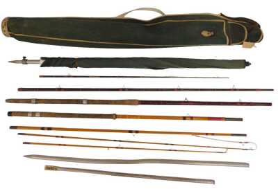 A fishing bag containing an umbrella and two rods, a Cuckoo three piece rod and a J Clayton of Boston Fenland two piece. (AF)