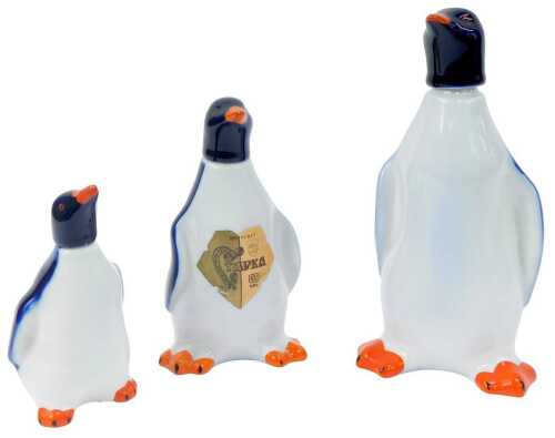 A set of three graduated USSR Lomonosov decanters, each modelled as a penguin, the largest 24cm high.