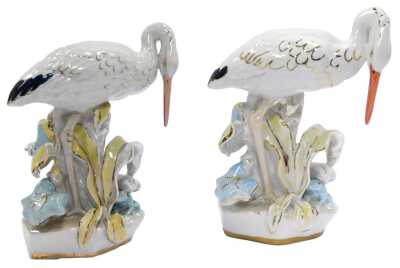 A pair of Dulevo porcelain bird figures, modelled as storks. 24cm high.