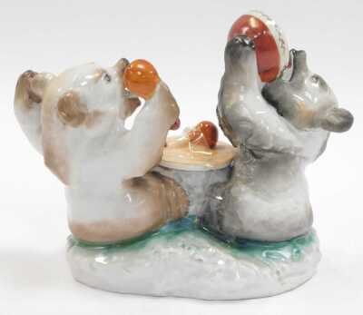 A Lomonosov porcelain inkwell, modelled as two bears, one eating fruit from a bowl, the other holding a spoon beside a tree stump, the lid enclosing a vacant interior, 13cm high. - 2