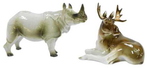 A Lomonosov porcelain figure modelled as a rhino, 16cm high, and a seated moose, 16cm high, each with printed marks.