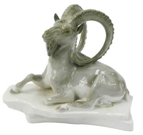 A USSR porcelain figure modelled as an ibex on rockwork base, printed marks, 21.5cm high.