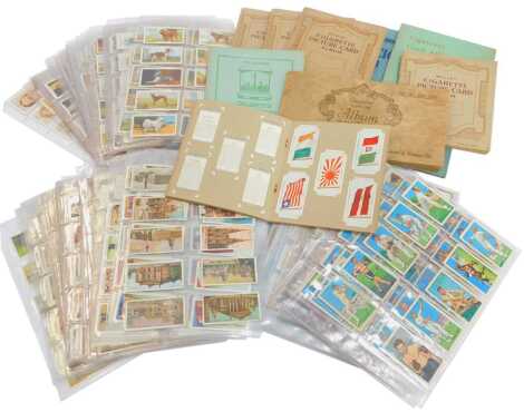 Various cigarette cards in albums and sleeves, to include Curious Beaks, Champions, Lucky Charms, etc. (1 box)