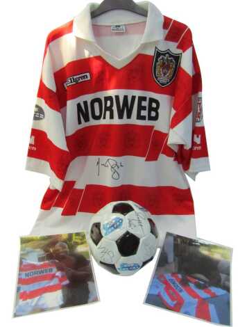 A Wigan Rugby League shirt, signed by Martin Offiah, with associated photographs, and a Soccer AM football, bearing autographs and messages, 18cm wide.