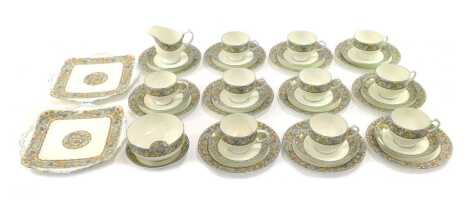 A Paragon porcelain part tea service, decorated with Paisley motifs to include teacups and saucers, milk jug, sugar bowl, cake plates, etc.