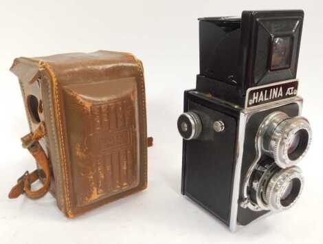 A Halina AI twin lens camera, in leather case.