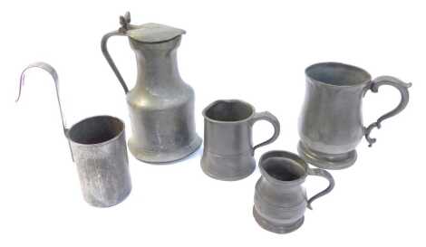 A group of 18thC and later pewter, to include a lidded jug with acorn thumb press, 18cm high, tankards, measuring vessel, etc. (5)