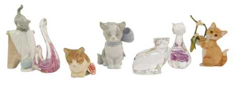 A group of collectables, to include a Lladro porcelain figure modelled as a cat wearing a bow, 10cm high, Country Artists figure A Christmas Wish, 03152, a Villeroy and Boch cat paperweight, etc. (1 tray)