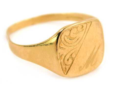 A 20thC 9ct gold signet ring, the square ring head with part scroll decoration and bearing the initial M, maker OPT, Birmingham, ring size T, 2.3g.