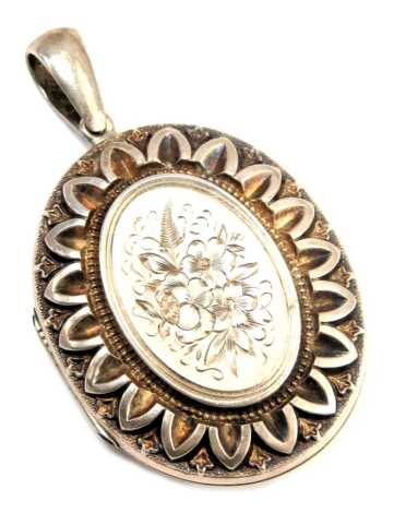 An Edwardian locket, of hammered floral design, white metal, unmarked, 4cm high, 15.1g all in. (AF)