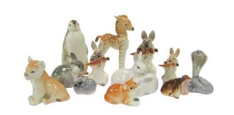 A group of Lomonosov and other porcelain animals, including a penguin, 15cm high, rabbit eating a carrot, 12cm high, zebra, 17cm high, etc. (1 tray)