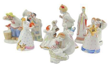 Various Russian porcelain figures, in differing poses, to include a figure kneeling tying a headscarf, 11cm high, a figure playing a musical instrument, 12cm high, etc. (a quantity)