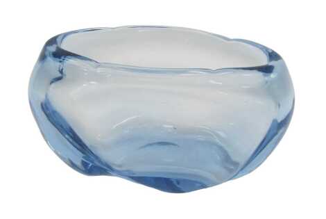 A Whitefriars blue glass bowl, of shaped form, designed by James Hogan, pattern number 9250, 27cm wide.