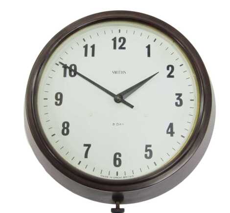 A Smiths Bakelite cased wall clock, with white circular dial bearing Arabic numerals, eight day movement, 26cm diameter.