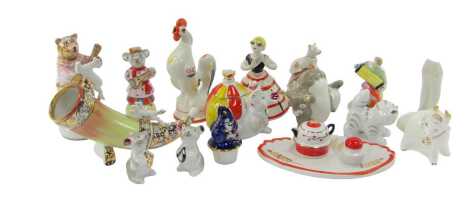 A group of Russian ceramics, to include a figure playing an accordion, a mouse and ball condiment pot and cover, cat figure, dog on kennel trinket box, etc. (1 tray)