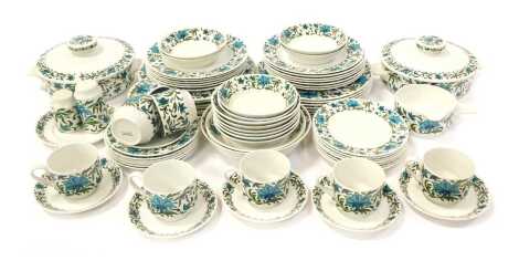 A Midwinter pottery coffee and tea service decorated in the Spanish Garden pattern, designed by Jessie Tate to include dinner plates, breakfast bowls, teacups, salt and pepper shaker, lidded tureens, etc. (a quantity)