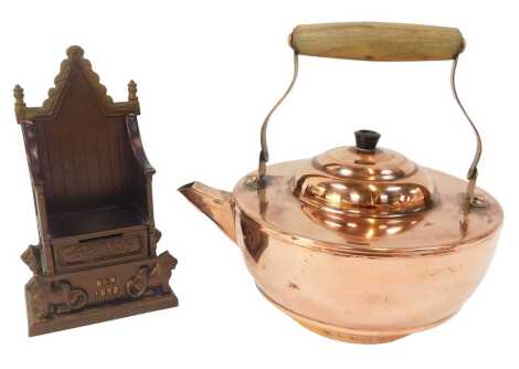 A Harper cast metal Elizabeth II Coronation chair money box, 21cm high, together with a copper teapot, with wooden handle. (2)