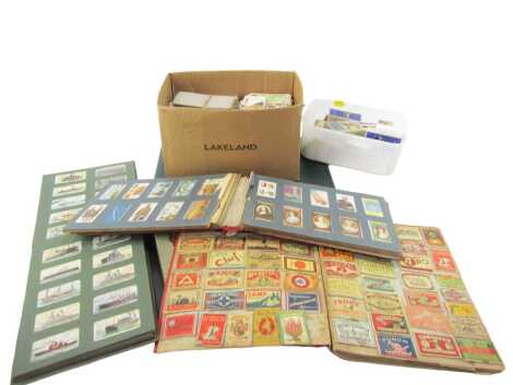 Various cigarette cards, loose and in albums to include Wills Cigarettes, Tenner, some sets, some in packets, together with an album containing matchbox covers.