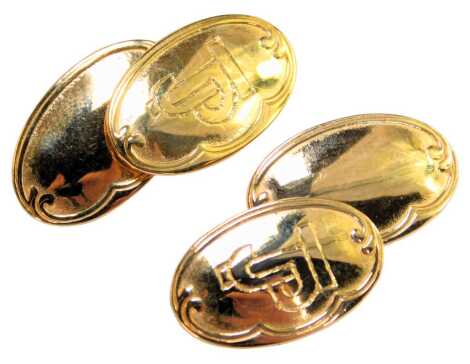 A pair of 9ct gold oval cufflinks, each with a fluted border, with central JP initials, with chain link, 6.2g, boxed.