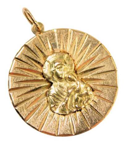 A religious pendant, the circular disc with mother and child figure, 3cm diameter, yellow metal, stamped K18, 4.6g.