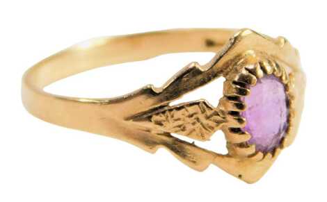 A 9ct gold amethyst dress ring, set with an oval amethyst in a claw setting, with pierced design shoulders, ring size N½, 1.4g.