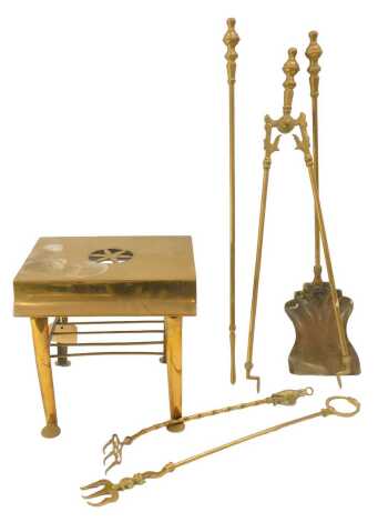 A group of brassware, comprising fireside trivet with pierced floral top and slatted under tier, 27cm high, together with fireside implements, shovel, poker, tongs and two toasting forks.