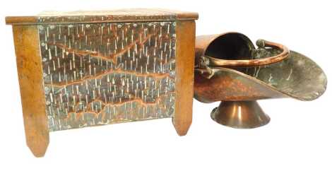 An early 20thC oak and embossed copper coal box, with Art Nouveau motif to lid, 35cm high, 46cm wide, 33cm deep, together with a copper coal scuttle. (2)