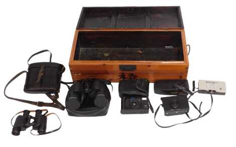 Two pairs of binoculars, to include a pair of Tasco 25x50mm binoculars, together with a Grundig EN3 recorder, and a Kodak Instamatic 133-X, contained in a pine case.