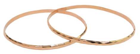 Two hammered rose gold bangles, yellow metal, stamped K14, 7.5cm and 6.5cm diameter, 12.2g.