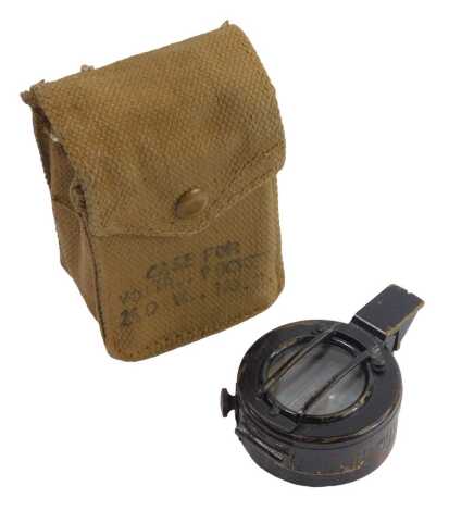 A TG Co Limited of London World War II military pocket compass, dated 1943 and number 230684, in a hessian pouch.