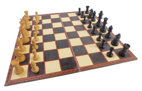 A Staunton chess set and draughts board.