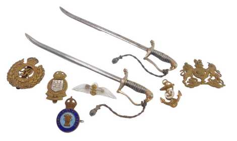 Militaria, comprising two ceremonial letter openers and various badges, one enamel set from the Army Catering Corps.