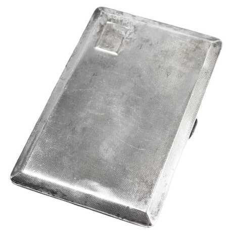 A George V silver cigarette case, with engine turned decoration and vacant cartouche, London 1933, 5.38oz.