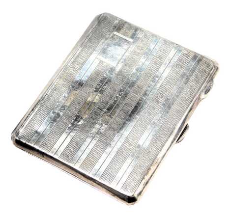 A George V silver cigarette case, of rectangular form with engine engraved decorated and vacant cartouche, Birmingham 1931, 2.14oz.