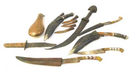 A group of Middle Eastern daggers, together with a dagger with wooden handle and curved blade, copper shot flask, etc. (1 box)