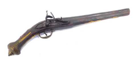 An Eastern flintlock pistol, possibly Indian, with wooden stock and brass decorative inlay, 48.5cm long. (AF)