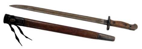 A 1907 pattern bayonet, stamped Sanderson and 1907, with leather and metal sheath, 57cm long.