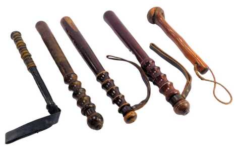 Five various wooden truncheons, including an ebonised and wire strung Eastern example, 27cm long, a beater, etc. (5)